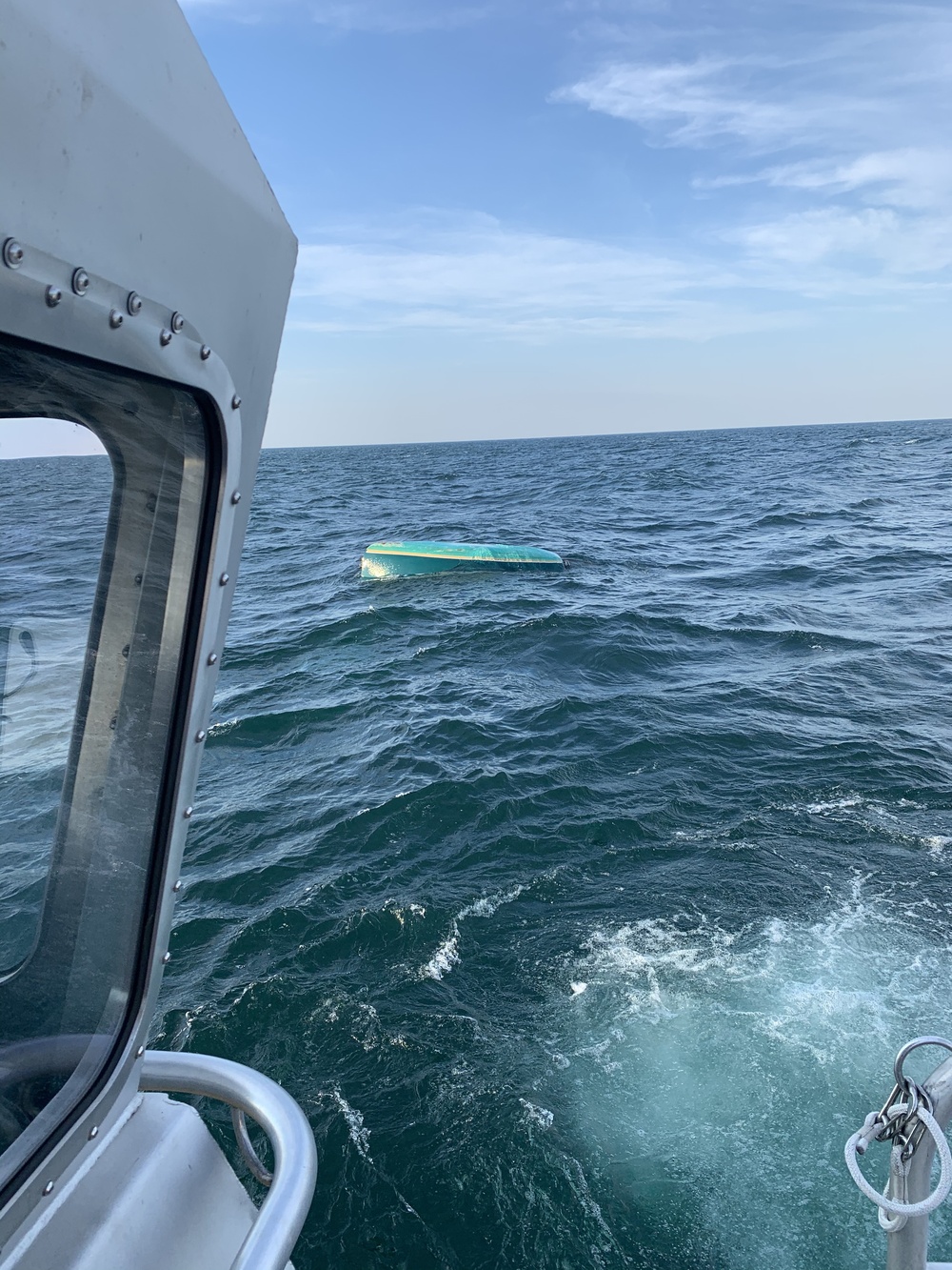 Coast Guard rescues 2 from capsized vessel