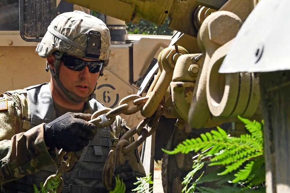 1073rd Maintenance Company Recover a Vehicle Under Simulated Fire During Northern Strike 20