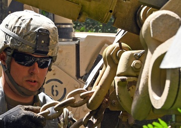 1073rd Maintenance Company Recover a Vehicle Under Simulated Fire During Northern Strike 20