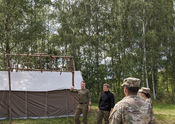Soldiers stationed in Poland share experiences with local scouts
