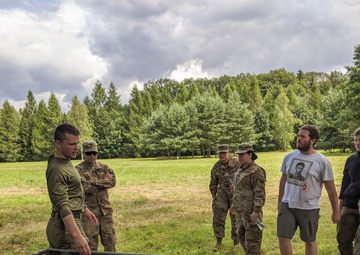 Soldiers stationed in Poland share experiences with local scouts