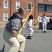 Logistics Specialist Seaman Recruit Patience Jones participates in pike drills with the crew of USS Constitution