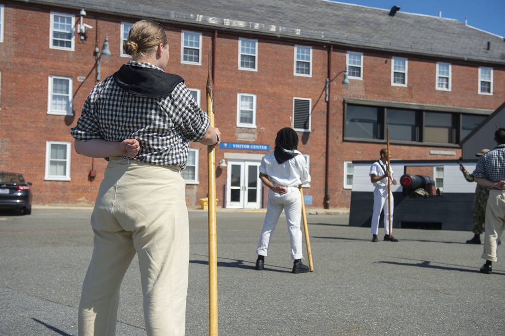 Logistics Specialist Seaman Recruit Patience Jones participates in pike drills with the crew of USS Constitution