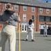 Logistics Specialist Seaman Recruit Patience Jones participates in pike drills with the crew of USS Constitution
