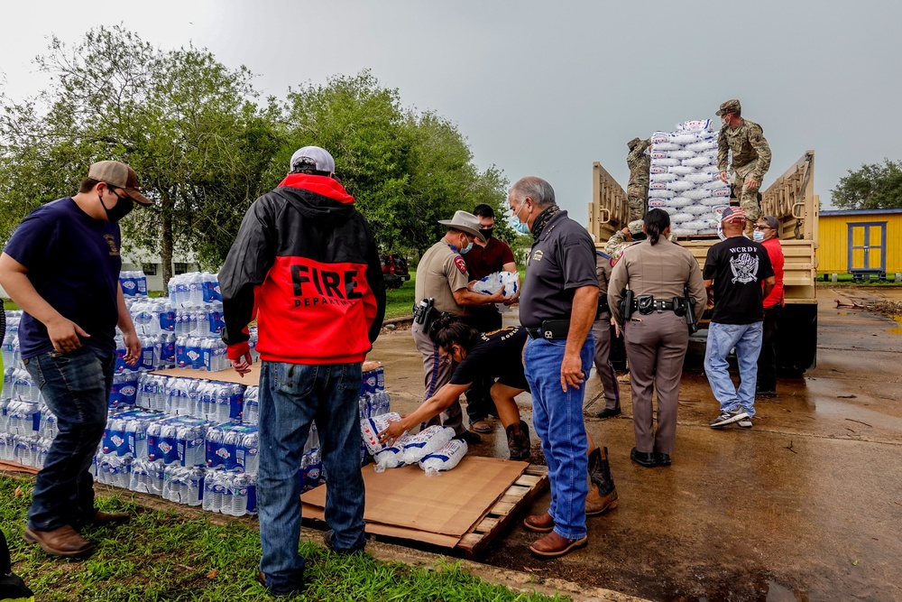 Texas Military Members deliver water and ice to south Texas towns affected by Hurricane Hanna