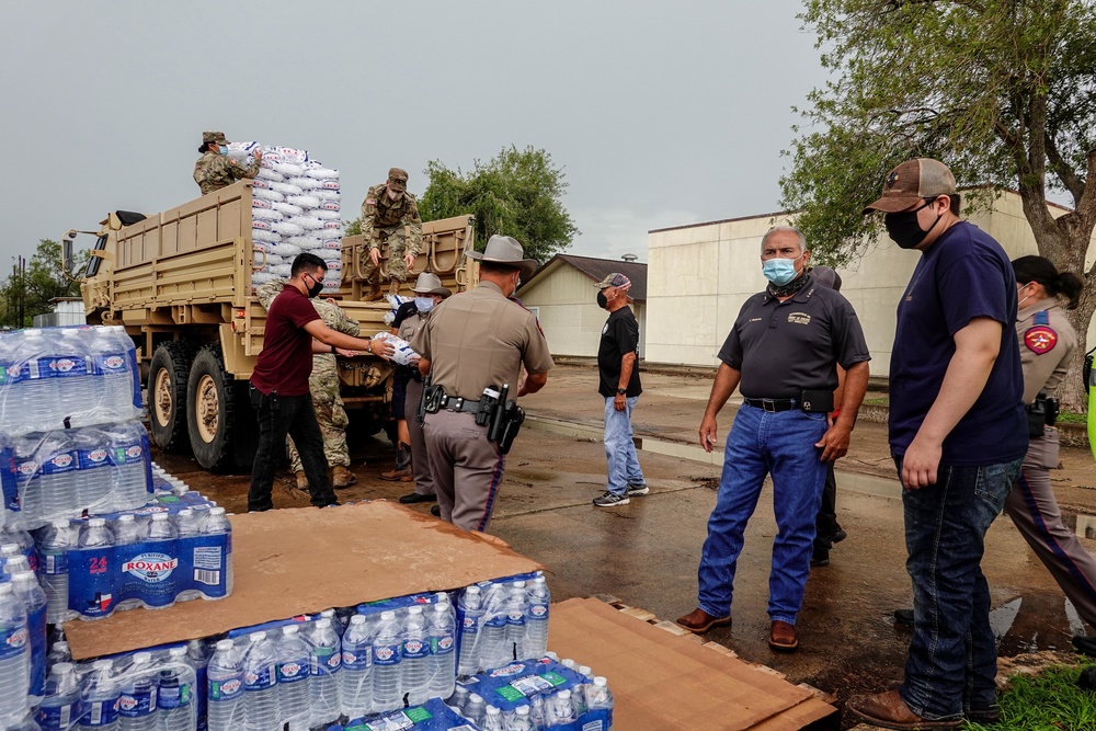 Texas Military Members deliver water and ice to south Texas towns affected by Hurricane Hanna