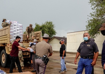 Texas Military Members deliver water and ice to south Texas towns affected by Hurricane Hanna