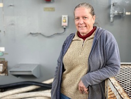 Ordinary Seaman Lynne Hazelip poses in her deck plate workspaces aboard USNS Benavidez