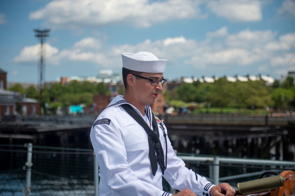 Boatswain’s Mate 1st Class Corey VanBeveren reads the names of sailors that lost their lives during the kamikaze attack aboard the USS Cassin Young (DD 793)