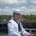 Boatswain’s Mate 1st Class Corey VanBeveren reads the names of sailors that lost their lives during the kamikaze attack aboard the USS Cassin Young (DD 793)