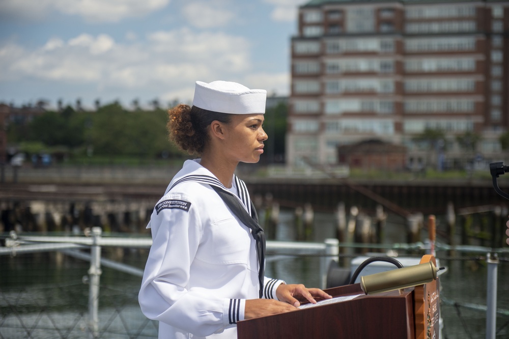 Hospital Corpsman Seaman Jaida Williams, assigned to USS Constitution, reads the names of sailors that lost their lives during the kamikaze attack aboard the USS Cassin Young (DD 793)