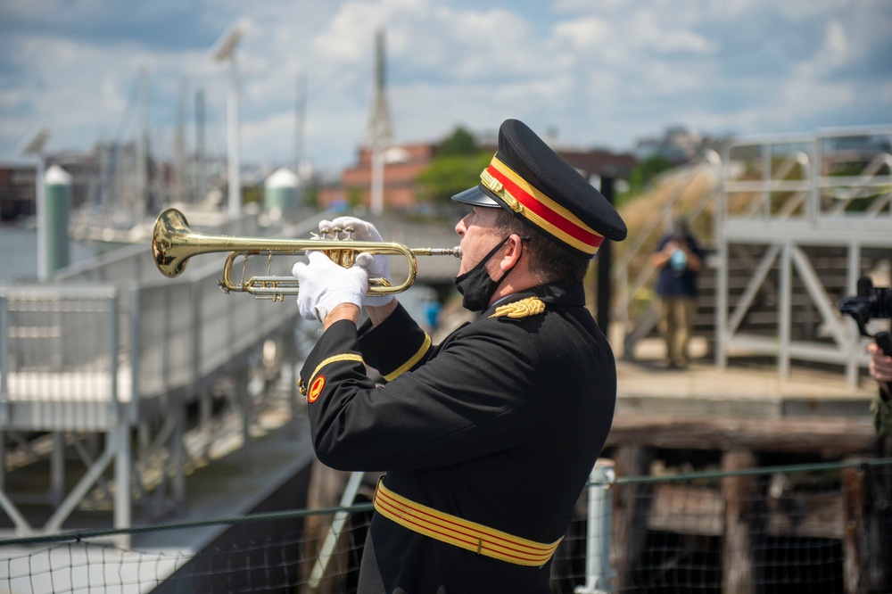 Lt. Bob Bean, retired, plays taps for the 75th anniversary of the kamikaze attacks on USS Cassin Young (DD 793)