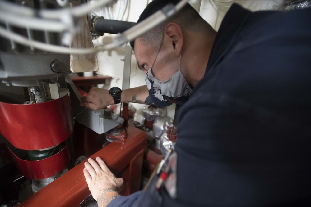 USS Ralph Johnson Sailors Maintain Engine Rooms