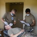 Paratrooper gets dental check in the field