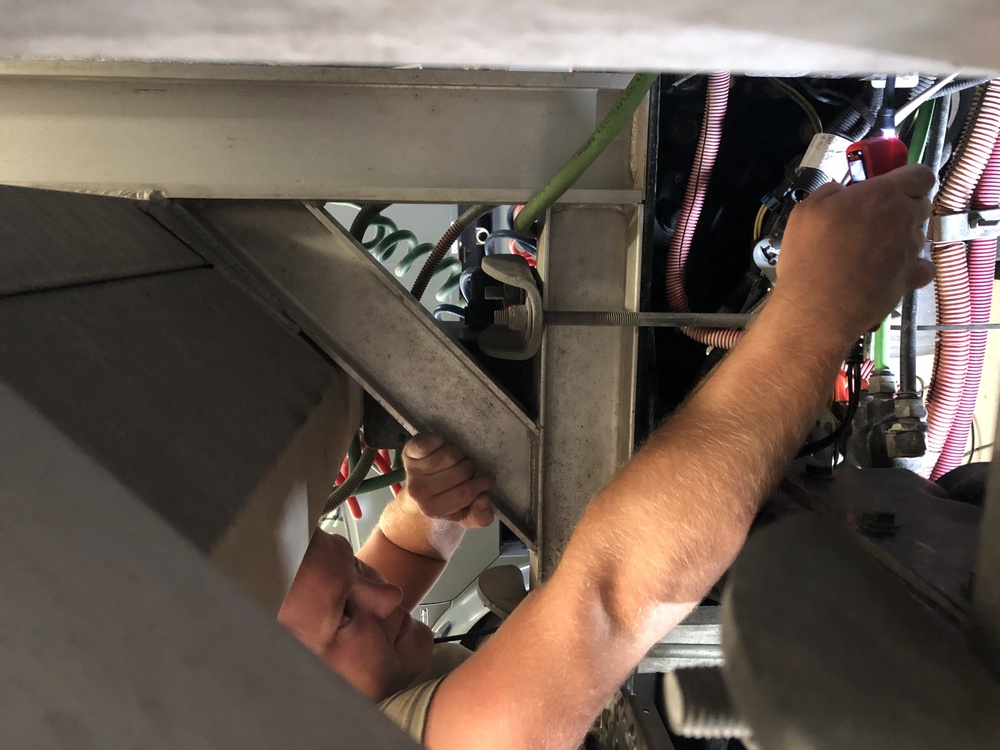 Nebraska Airmen performs routine vehicle maintenance
