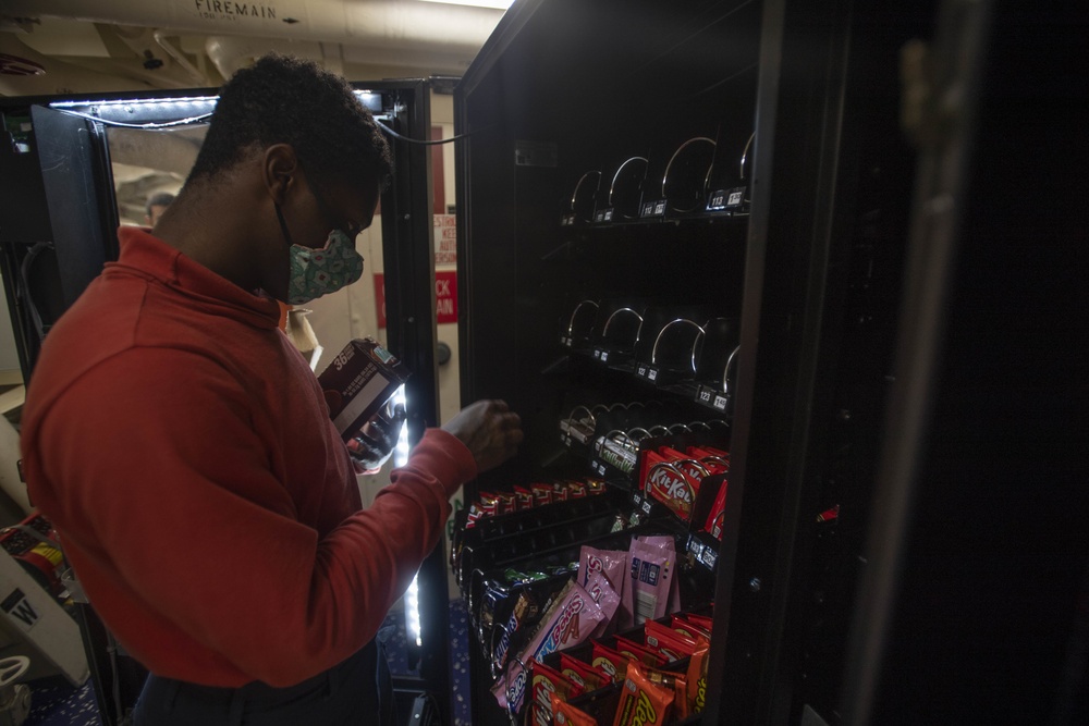 USS Ralph Johnson Sailor Restocks Vending Machines