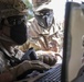 Staff Sgt. Jones works with a cyber warfare trainer of 3rd Infantry Division