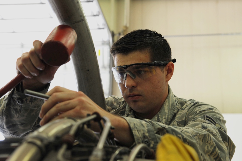 Propulsion Mechanic Performs Maintenance on F-15C Engine