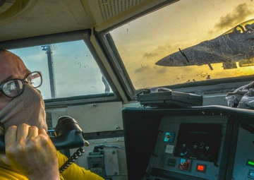 Aircraft Shooter Communicates With Waist Bubble To Coordinate Covey Launch On Flight Deck Aboard Aircraft Carrier USS Nimitz CVN 68