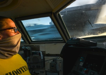 Aircraft Shooter Lt. Amy Blades-Langjahr Tracks Launch In Bow Bubble On Flight Deck Aboard Aircraft Carrier USS Nimitz CVN 68