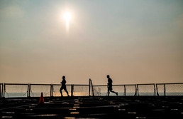 Sailors Aboard USS Germantown (LSD 42) Run on the Flight Deck During “Germantown Runs the World” Event