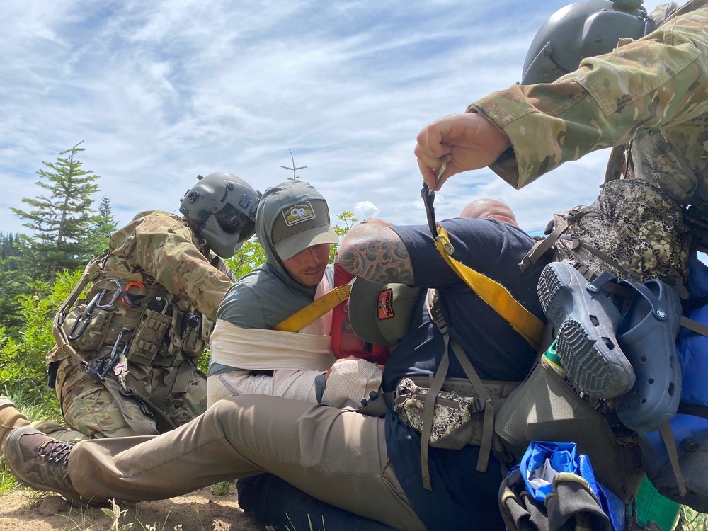 Air and Army National Guardsmen help injured hiker after rock slide