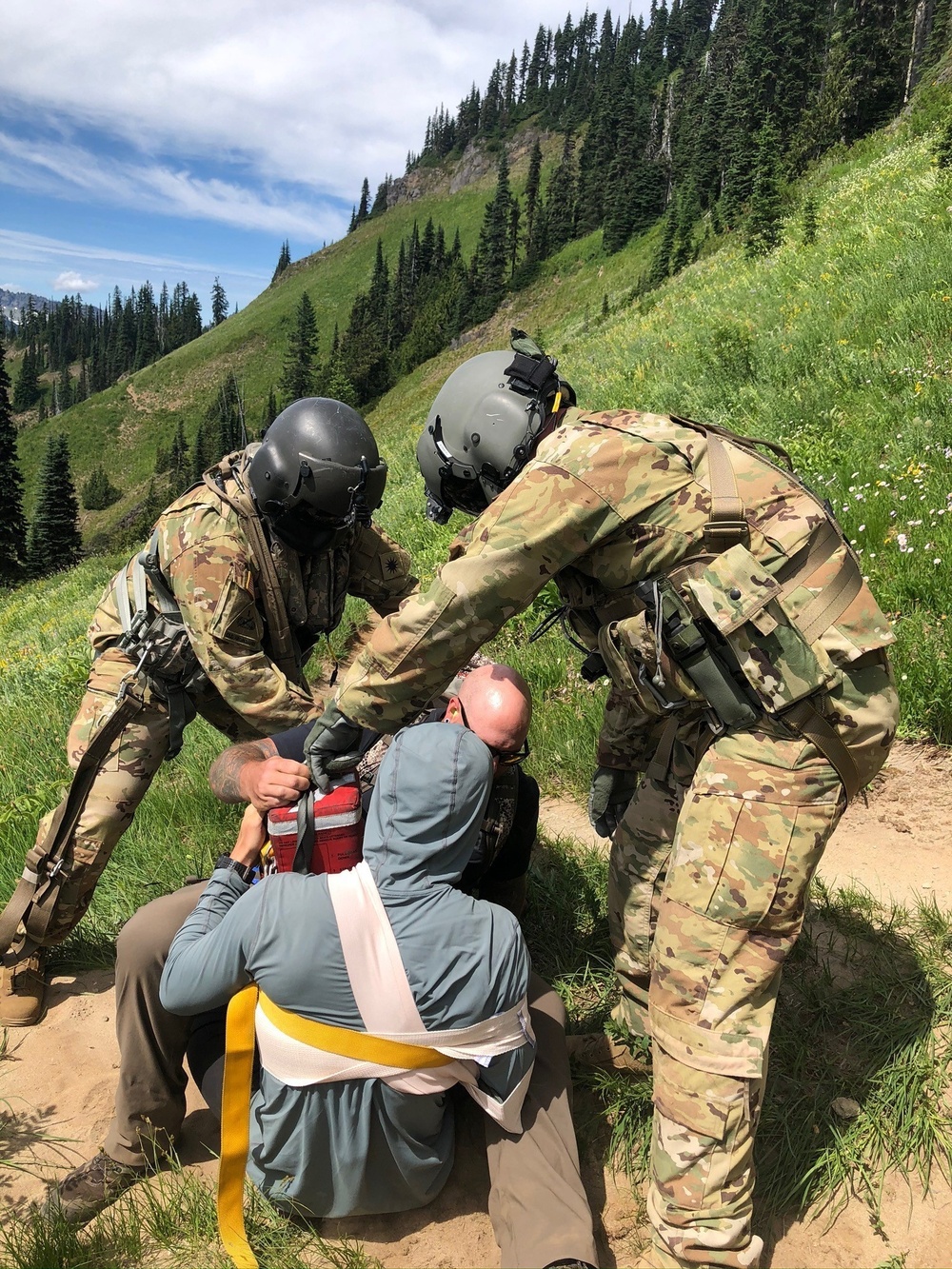 Air and Army National Guardsmen help injured hiker after rock slide