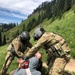 Air and Army National Guardsmen help injured hiker after rock slide