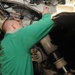 U.S. Navy Sailor Inspects Landing Gear