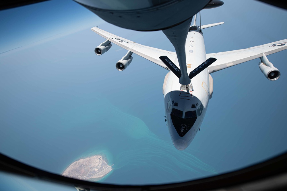 KC-135 Stratotanker refuels E-3 Sentry