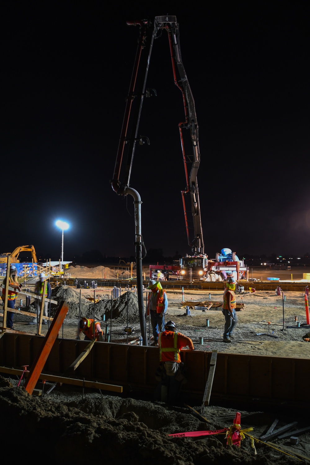 Workers pour concrete at future Stockton VA clinic