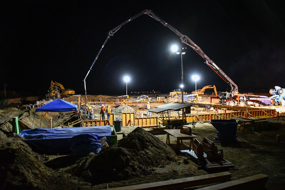 Workers pour concrete at future Stockton VA clinic