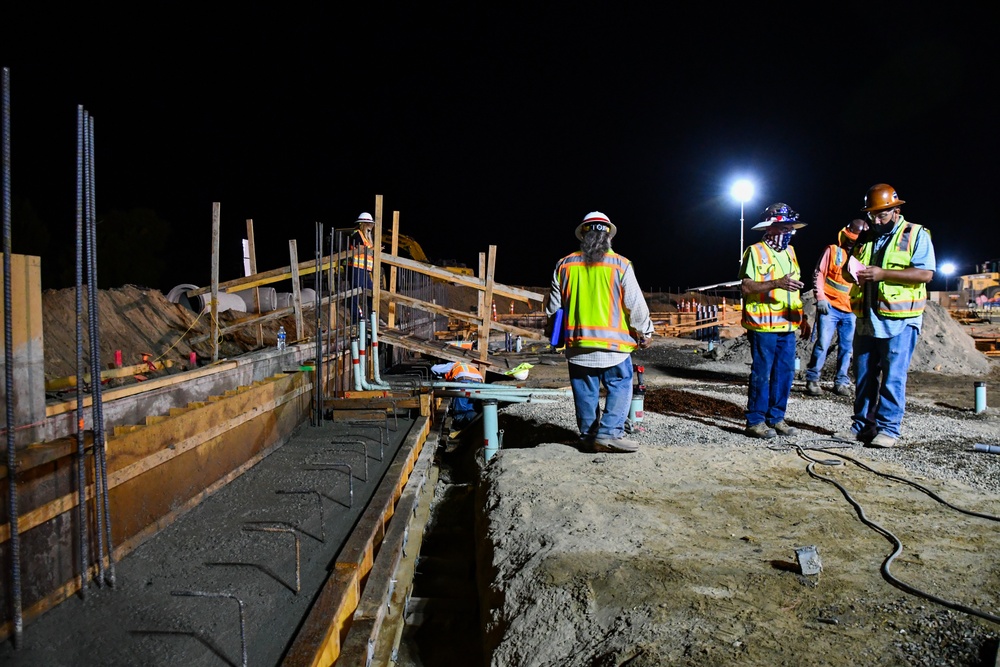 Workers pour concrete at future Stockton VA clinic
