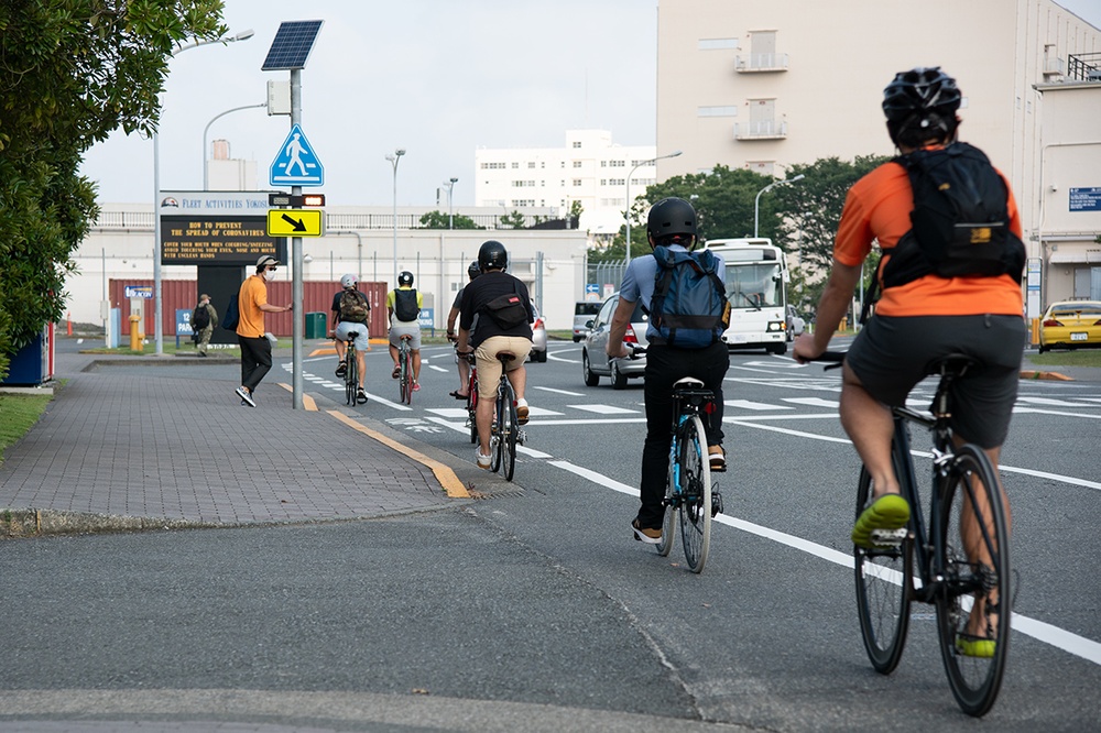JAPANESE CYCLISTS RIDE INTO WORK AT CFAY