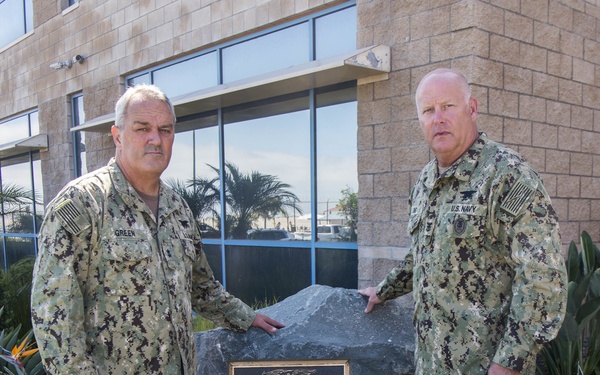Rear Adm. Collin Green, Commander, Naval Special Warfare Command, left, and Naval Special Warfare Force Master Chief (SEAL) Bill King lay a wreath on the Extortion 17 Memorial in observance of the 9th anniversary of Extortion 17.