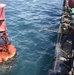 Coast Guard Cutter Joshua Appleby crew conducts maintenance on buoys near Port Everglades