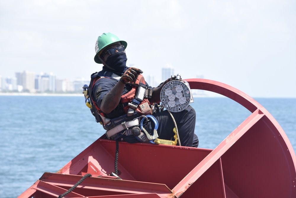 Coast Guard Cutter Joshua Appleby crew conducts maintenance on buoys near Port Everglades