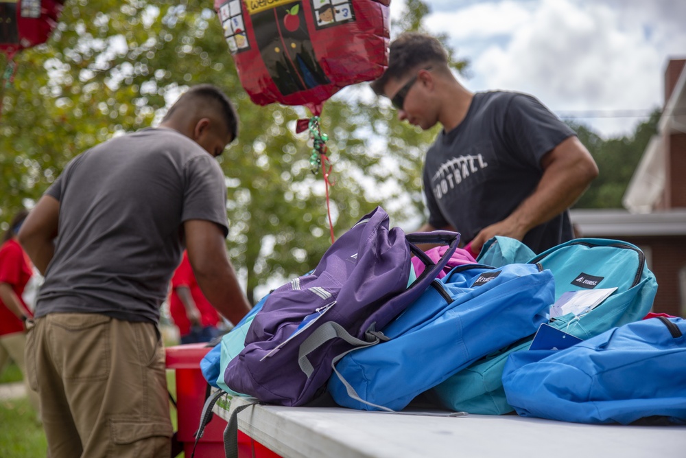 Camp Lejeune School Liaison staff and volunteers welcome students back to school