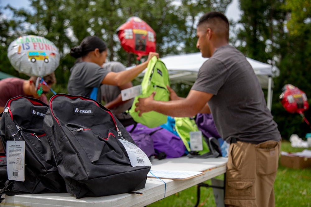 Camp Lejeune School Liaison staff and volunteers welcome students back to school