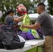 Camp Lejeune School Liaison staff and volunteers welcome students back to school