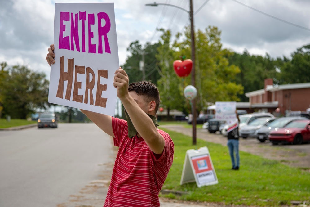 Camp Lejeune School Liaison staff and volunteers welcome students back to school