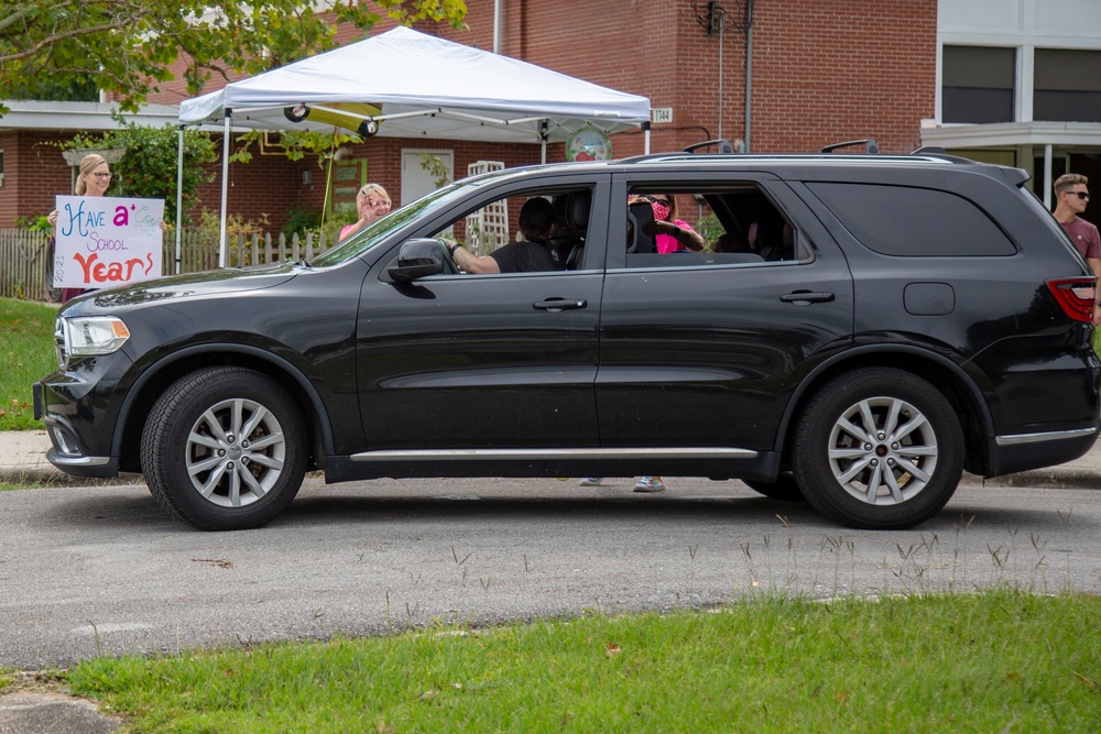 Camp Lejeune School Liaison staff and volunteers welcome students back to school