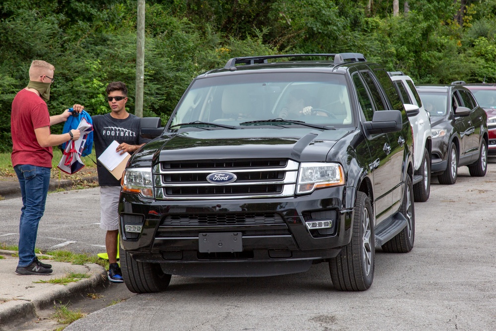 Camp Lejeune School Liaison staff and volunteers welcome students back to school