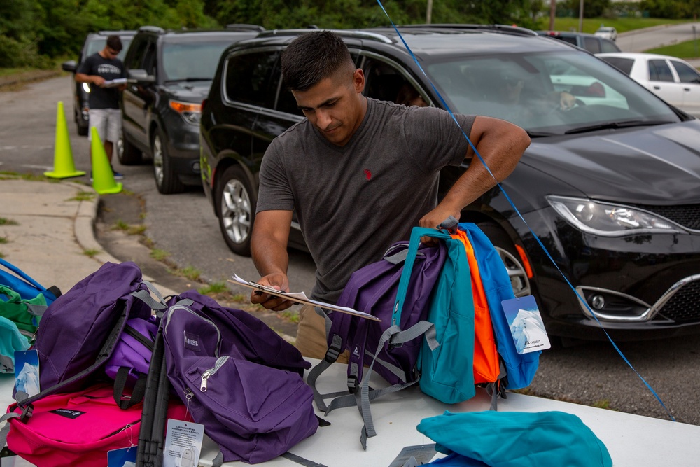 Camp Lejeune School Liaison staff and volunteers welcome students back to school