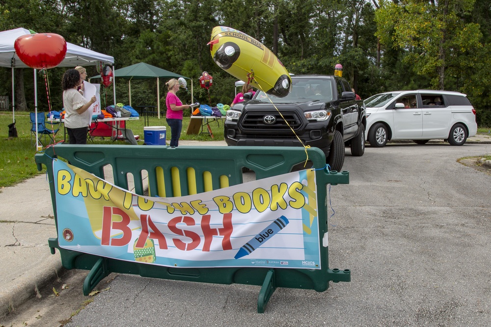 Camp Lejeune School Liaison staff and volunteers welcome students back to school