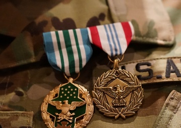 Outgoing Fort Hamilton MEPS Commander Proudly Displays New Medals