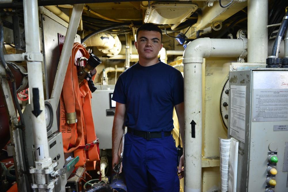 Coast Guard crew members perform pre- patrol repairs and maintenance