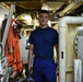 Coast Guard crew members perform pre- patrol repairs and maintenance