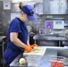 Coast Guard culinary specialist prepares food for crew members