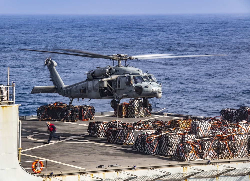 An MH-60S Sea Hawk Helicopter Transports Cargo To Nimitz